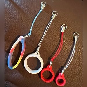 4 different size Silicone rings each w/ keychain rope w/ jump ring & clip